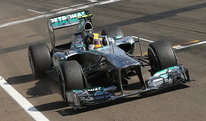 Lewis Hamilton crosses the finish line at the 2013 Hungarian Grand Prix