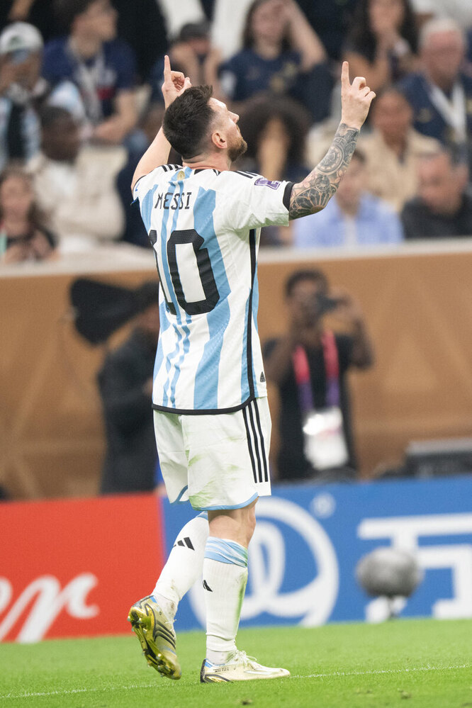 When scoring a goal, Messi raises both hands up, pointing his fingers to the sky.